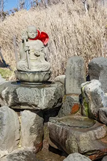 Warm spring water and Buddha statue