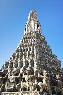 Wat Arun or Temple of Dawn over blue sky