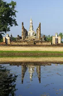 Wat Mahathat Temple and a Buddha statue in the temple of the Unesco World Heritage Site