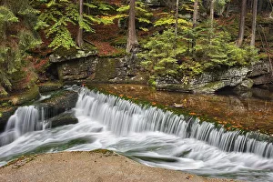 Water cascade on szklarka stream in autumn forest of Karkonoski National Park