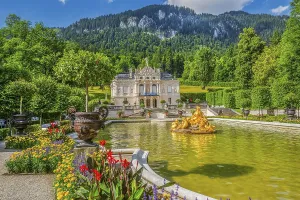 Water parterre with golden fountain and the front view of Linderhof Palace