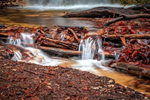 The waterfall in the Rautal forest at Burschenplatz in winter, Jena, Thuringia, Germany, Europe