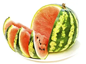 Watermelon With Slices At Plate Against The White Background Daugavpils