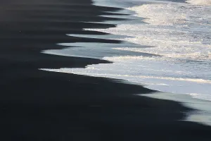 Waves on the black beach. Coast at Dyrholaey