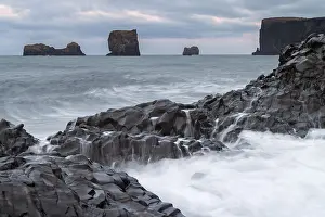 Waves, surf, washed over columnar basalt
