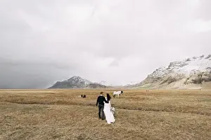 Wedding couple in after with horses