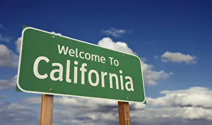 Welcome to california green road sign over blue sky with some clouds