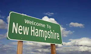 Welcome to new hampshire green road sign over blue sky with some clouds
