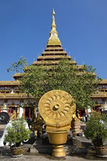 Wheel of Life in front of a nine-story Stupa Phra Mahathat Kaen Kakhon