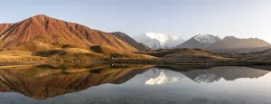 Category Mountain Landscapes Prints: White glaciated and snowy mountain peak Pik Lenin at sunset
