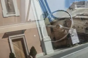 White interior of vintage car. White steering wheel