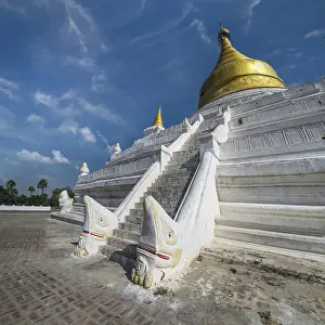 White Pagoda at Inwa ancient city with lions guardian statues