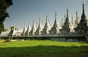 Many white stupas forming several rows