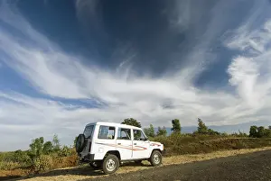 White sumo car under dramatic sky at Chikhaldara