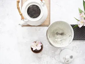 White teapot with bamboo handle