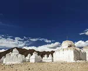 Whitewashed chortens (Tibetan Buddhist stupas)