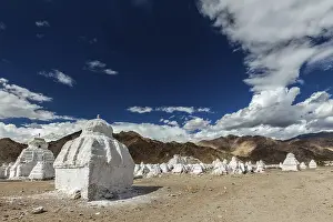 Whitewashed chortens (Tibetan Buddhist stupas)
