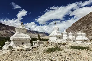 Whitewashed chortens (Tibetan Buddhist stupas)