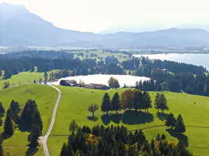 Wide, green landscape with wooded areas