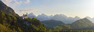 Wide panoramic landscape with castle and alpine background