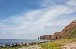 Wide, sunny coastline with concrete tetrapods by the sea