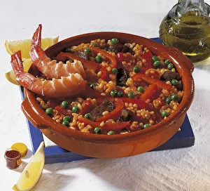 Wild boar paella with peppers, peas