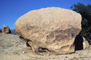 Wind erosion and weathering of a large granite block in a desert area in Morocco, North Africa