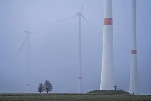 Wind farm in fog, dark doldrums