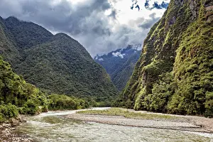 Framed Print : Winding river path through a lush green valley