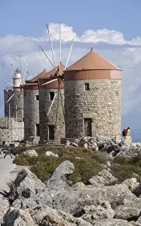 Windmills and lighthouse in Mandraki Harbour