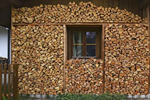 Window framed by the scalped firewood