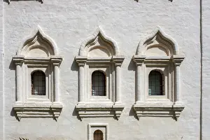 Windows with bars in an old stone monastery