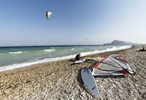 Windsurfer wearing helmet on the beach