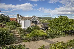 A winery with a blue sky, restaurant and bar in the vineyards of Heviz