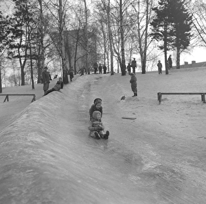 Winter in the 1950s. Children are playing in a park in Stockholm