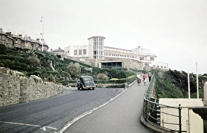 Winter Gardens pavilion building, Ventnor, Isle of Wight, Hampshire, England, UK 1960 1930s Art Deco architecture, Morris 8 car climbing the hill