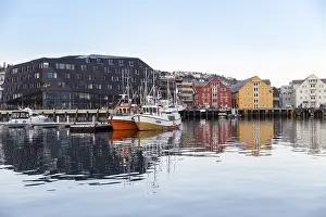 Winter in the harbour of Tromsoe with ship