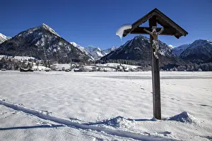 Winter landscape in the snow, wayside cross