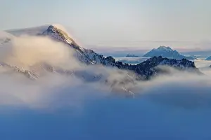 Winter peaks of the Ammergau mountains with sea of fog