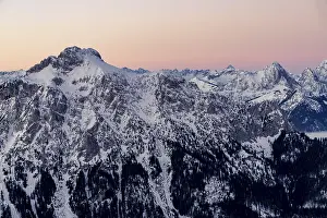 Winter peaks of the Tannheimer Berge at blue hour with sea of fog