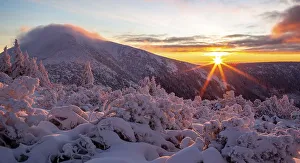 Winter sunrise in the Karkonosze Mountains with a view of snieZka peak
