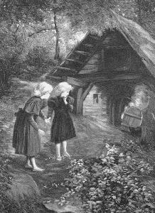 The witch lives here, two girls stand in front of a small forest hut