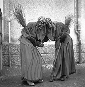 Witches with broom in hand, carnival