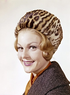 Woman of the 1960s. She is wearing a winter fur hat