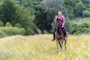Woman, 24 years, galloping on horse, Germany