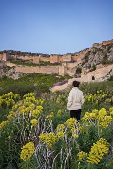 A woman admires the ancient Greek fortress