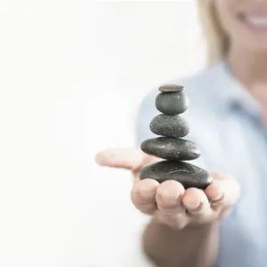 Woman balancing stones
