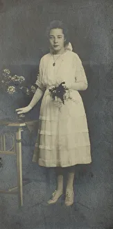 Woman with bouquet of flowers, visiting format