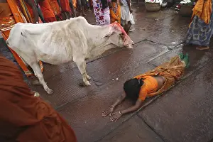 Woman bowing down to god srabani purnima