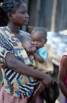 Woman breastfeeding baby, Madagascar, Africa